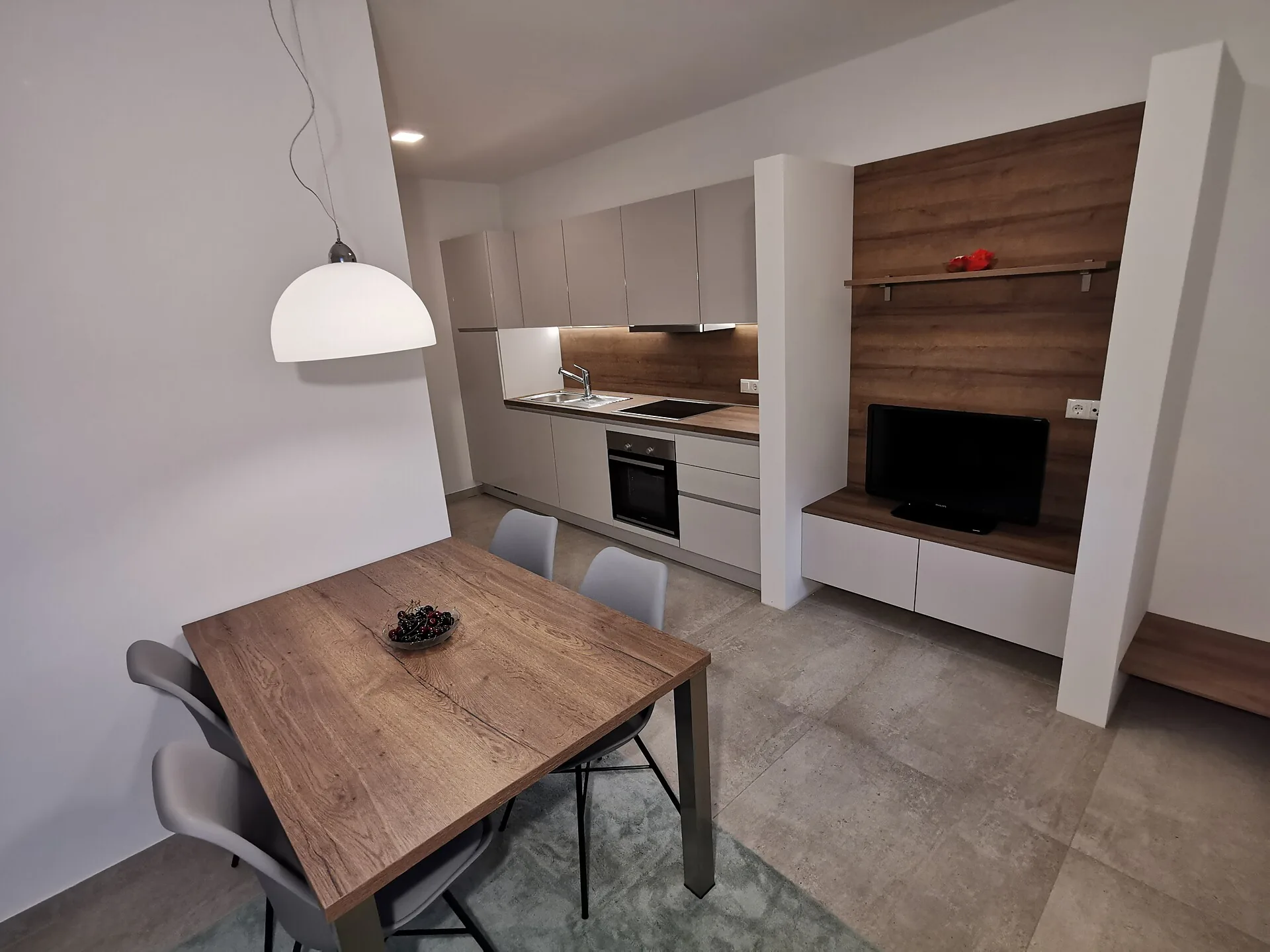 Moderner Wohn- und Essbereich im Apartment Magnolie